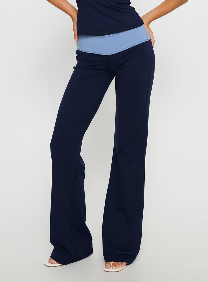 side view of model wearing Princess Polly Kobee Jersey Flare Pants Navy / Light Blue High Rise Pants