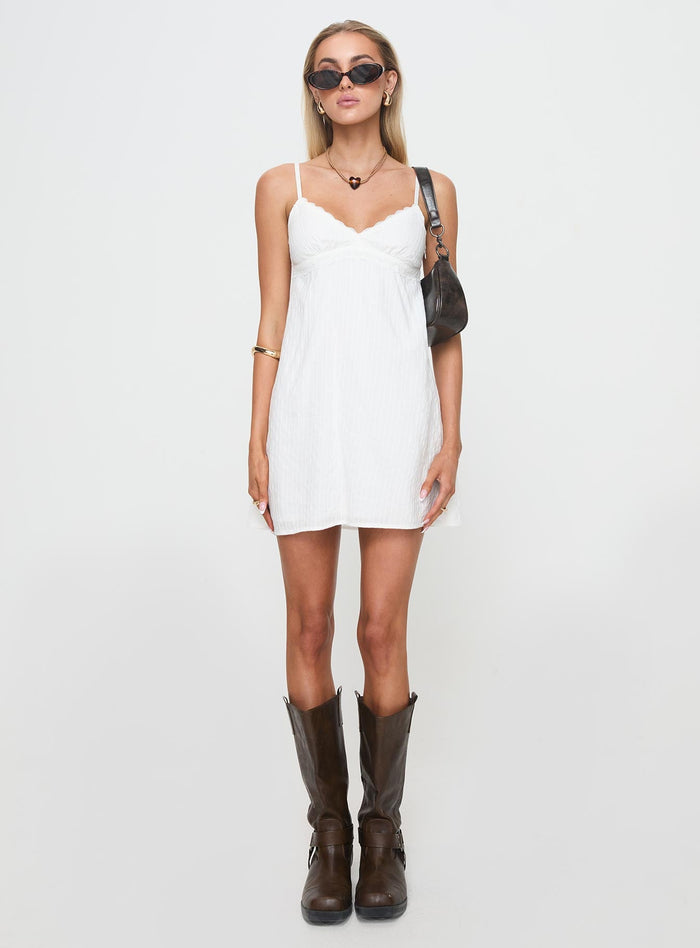 side view of model wearing Princess Polly Lunya Mini Dress White Plunger