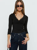 front view of model wearing Princess Polly Lyselle Wrap Detail 3/4 Sleeve Bodysuit Black Quarter Sleeve Bodysuit