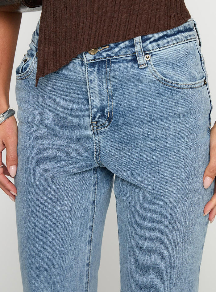 side view of model wearing Princess Polly Magic Mirror Mid Rise Bootleg Jeans Ice Wash Mid Rise