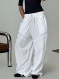 Discover the Mankind Baggy Cargo Pants White in womens-regular-pants with mid-rise, front view of model wearing Princess Polly