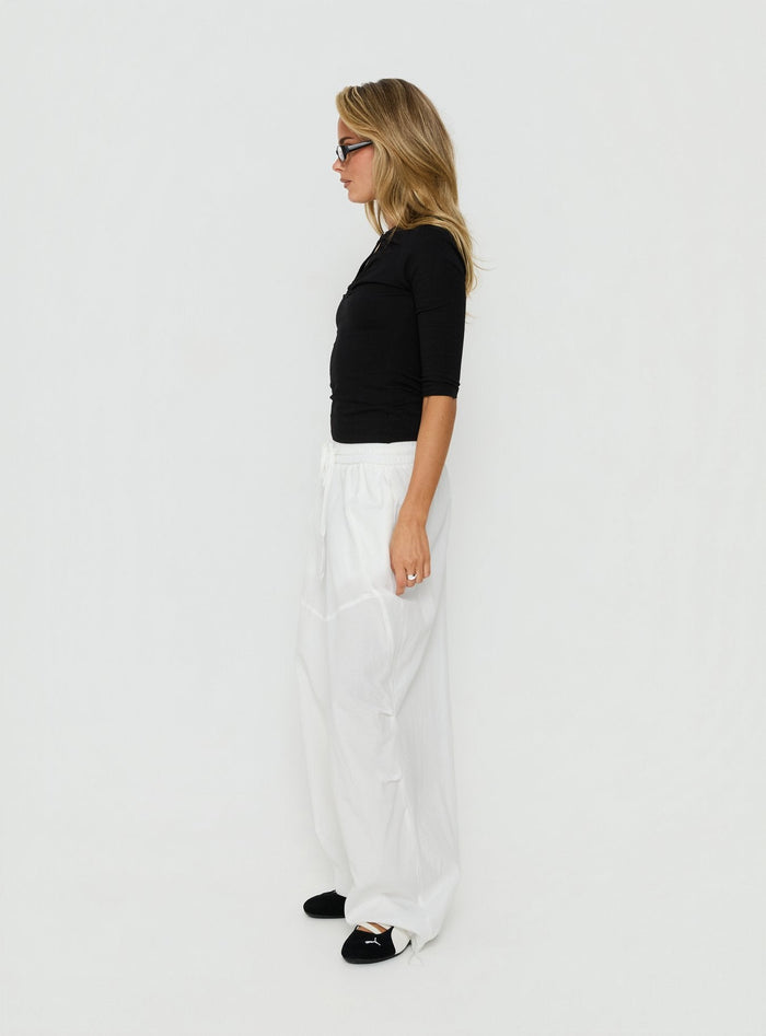 Explore the Mankind Baggy Cargo Pants White in womens-regular-pants with mid-rise, side view of model wearing Princess Polly