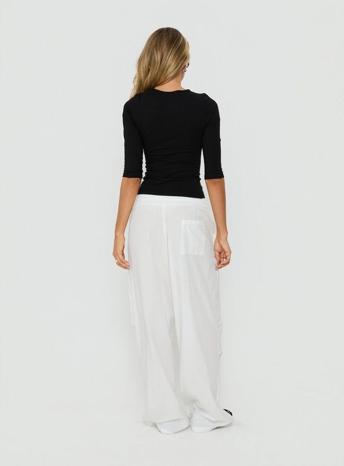 Introducing Mankind Baggy Cargo Pants White in womens-regular-pants with mid-rise, back view of model wearing Princess Polly