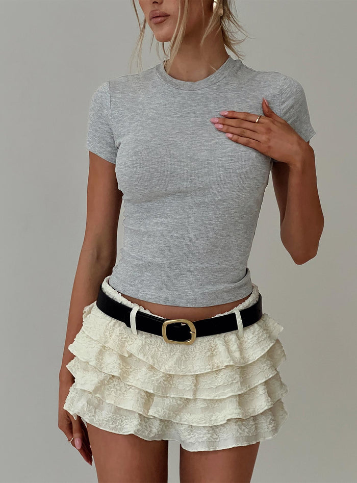 front view of model wearing Princess Polly Match Point Mini Skort Porcelain Low Rise Shorts