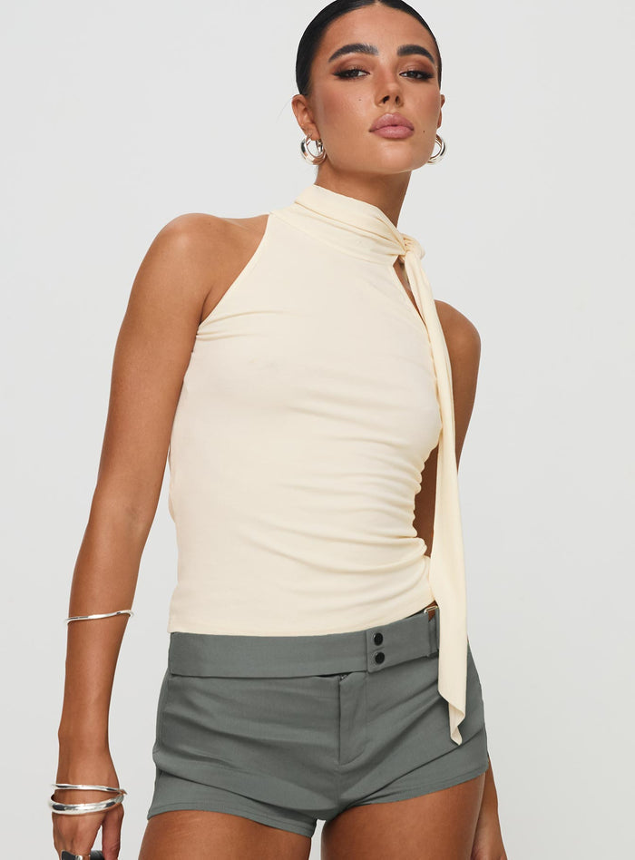 front view of model wearing Princess Polly Mathias Top Cream Sleeveless High Neck