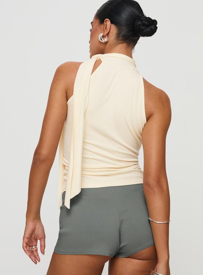 back view of model wearing Princess Polly Mathias Top Cream Sleeveless High Neck