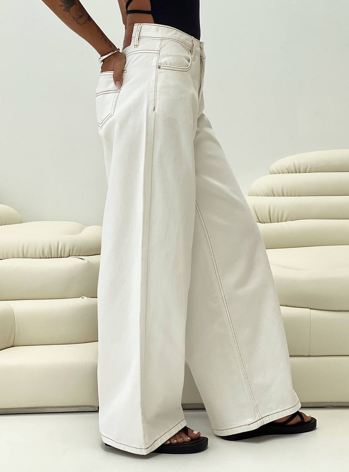front view of model wearing Princess Polly Naylor Wide Leg Jeans Cream Petite Low Rise Jeans