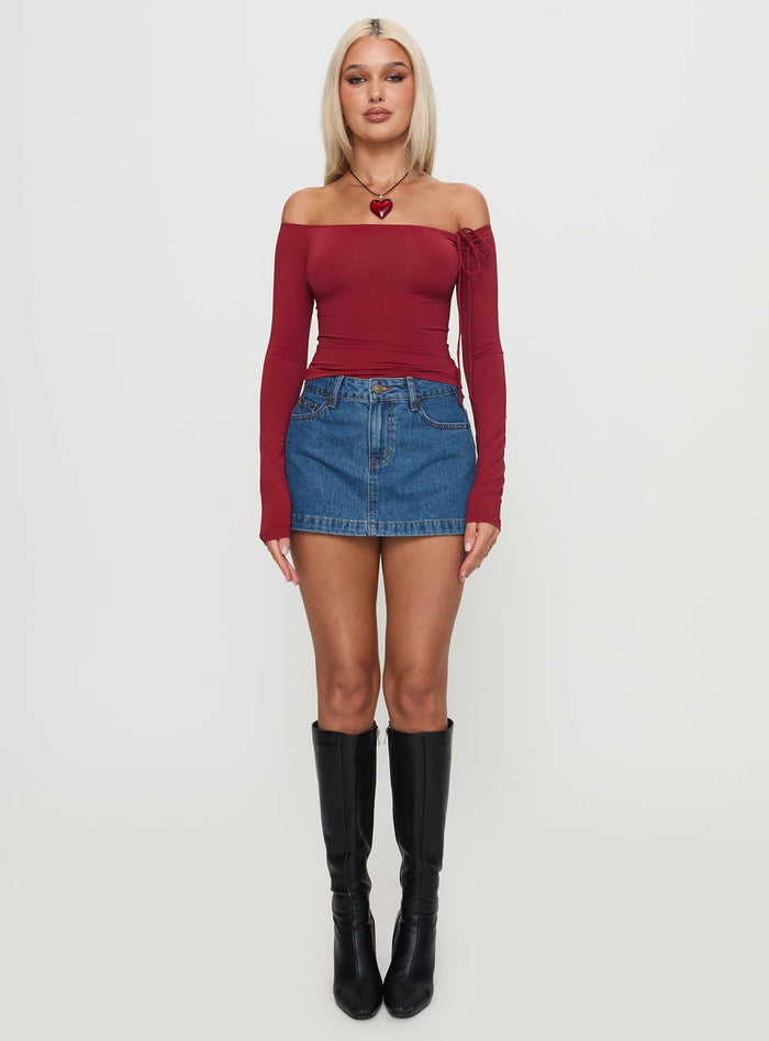 side view of model wearing Princess Polly Nicolina Low Rise Denim Mini Skirt Light Wash Mini Skirts