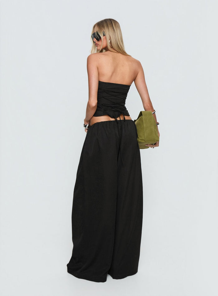 back view of model wearing Princess Polly Odara Wide Leg Pants Black Low Rise Pants