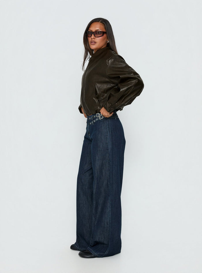 side view of model wearing Princess Polly Paltrow Mid Rise Wide Leg Cargo Jeans Dark Blue Wash Mid Rise Jeans