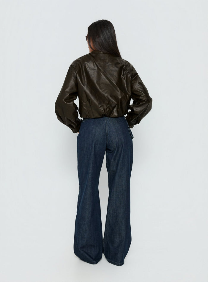 back view of model wearing Princess Polly Paltrow Mid Rise Wide Leg Cargo Jeans Dark Blue Wash Mid Rise Jeans