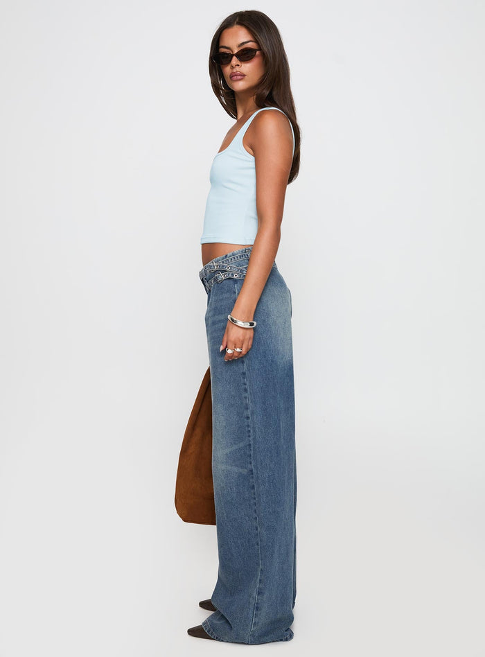 side view of model wearing Princess Polly Paltrow Cargo Jeans Mid Blue Wash Mid Rise