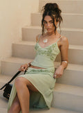 side view of model wearing Princess Polly Pappilion Top Sage Sleeveless Plunger