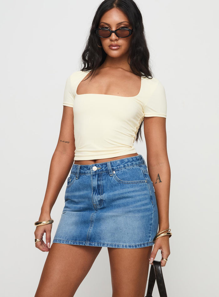 side view of model wearing Princess Polly Paulette Denim Mini Skirt Light Wash Mini Skirts