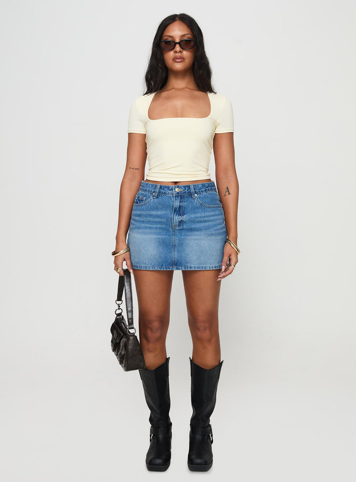 front view of model wearing Princess Polly Paulette Denim Mini Skirt Light Wash Mini Skirts