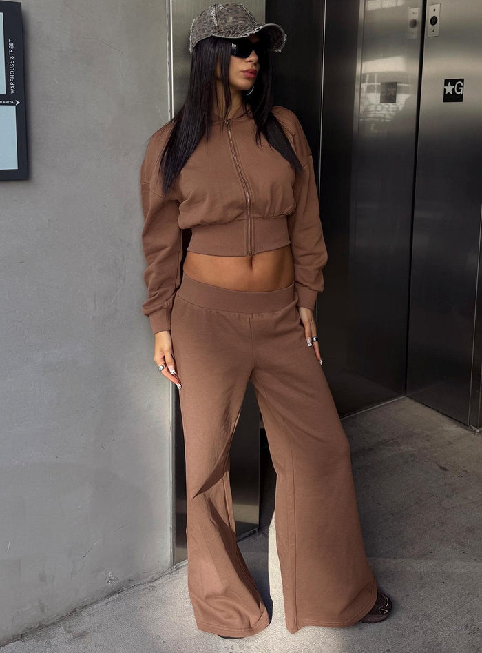 front view of model wearing Princess Polly Peaks Flared Track Pants Cocoa Mid Rise Pants