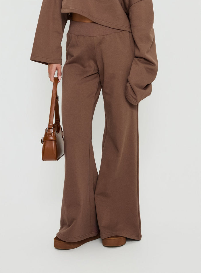 side view of model wearing Princess Polly Peaks Flared Track Pants Cocoa Mid Rise Pants