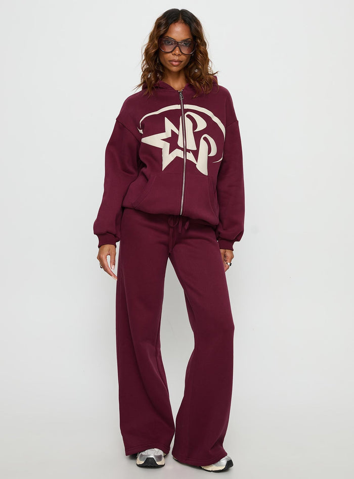 side view of model wearing Princess Polly Princess Polly Stargirl Zip Through Jumper Burgundy