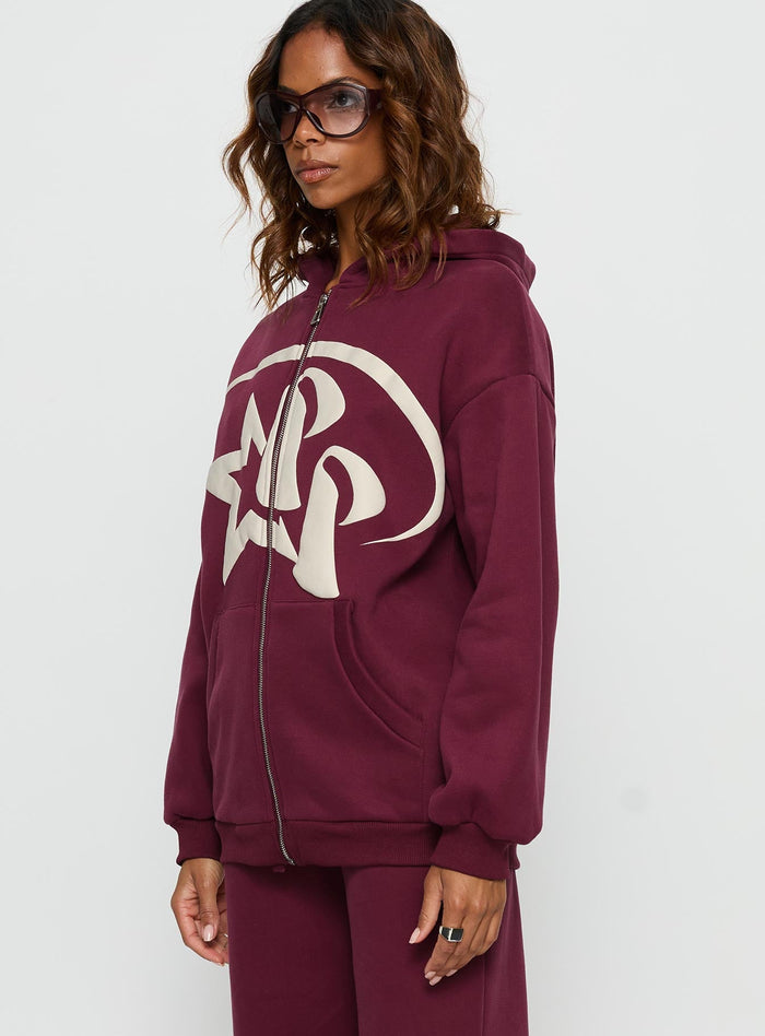 side view of model wearing Princess Polly Princess Polly Stargirl Zip Through Jumper Burgundy