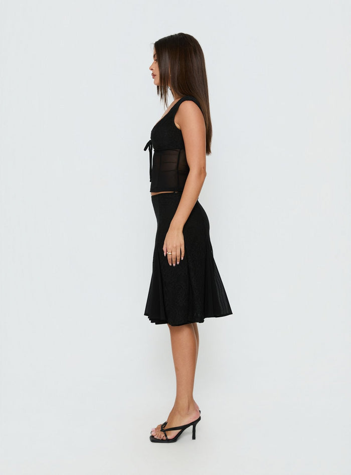 Crafted from lace the Quani Lace Midi Skirt Black womens-skirts in fitted aline shape with midi length side view of model wearing Princess Polly