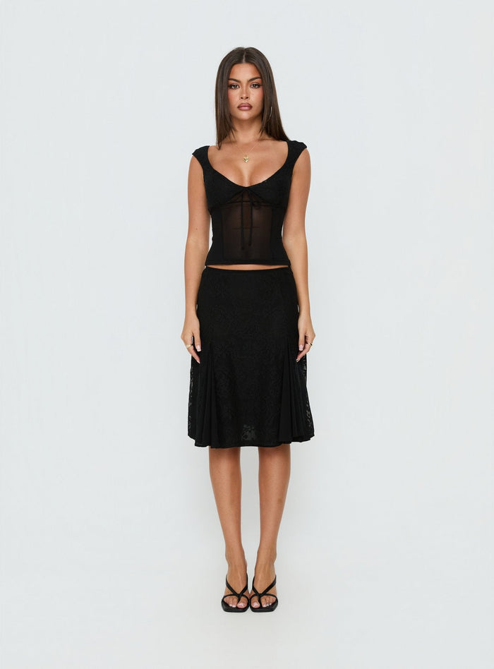 Showcasing the Quani Lace Midi Skirt Black womens-skirts in midi length front view of model wearing Princess Polly