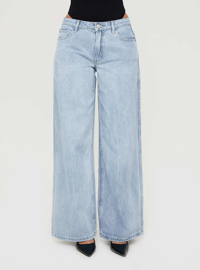 side view of model wearing Princess Polly Ramos Low Rise Denim Jeans Light Wash Petite Low Rise Jeans