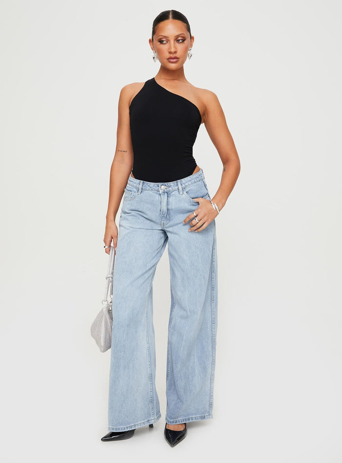 front view of model wearing Princess Polly Ramos Low Rise Denim Jeans Light Wash Petite Low Rise Jeans