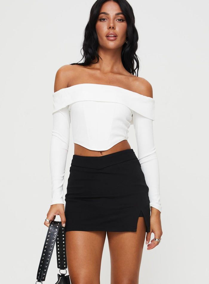 front view of model wearing Princess Polly Ravyn Skort Black Tall High Waisted Shorts