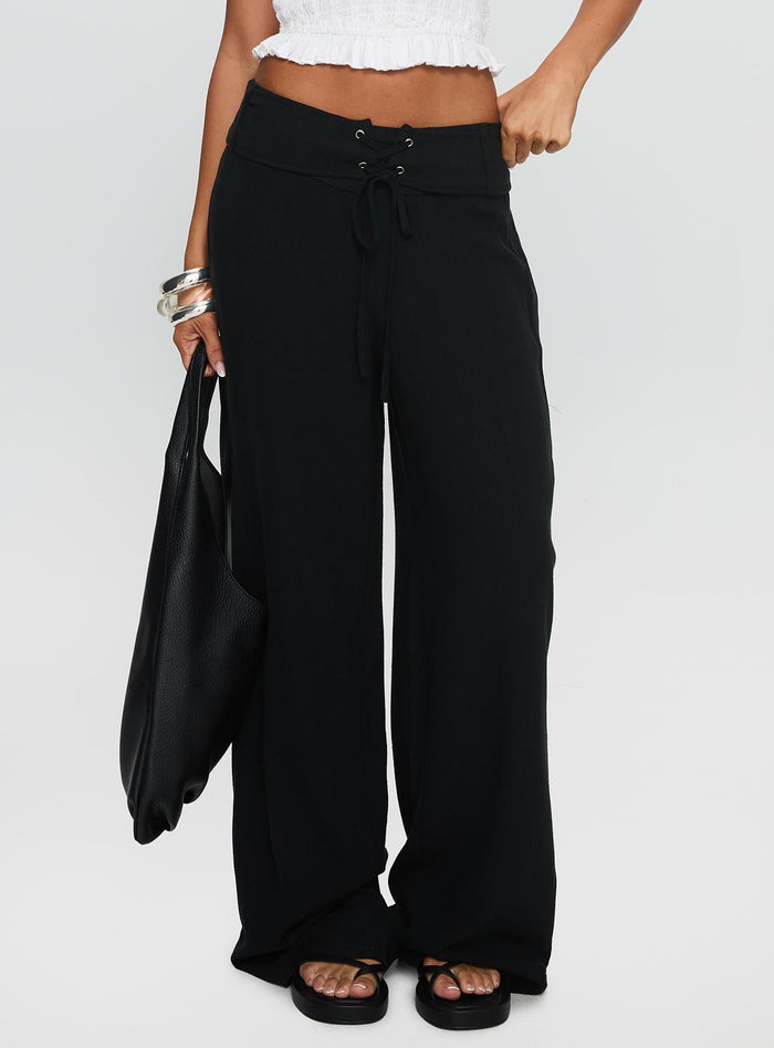 side view of model wearing Princess Polly Raymonde Pants Black High Waisted Pants