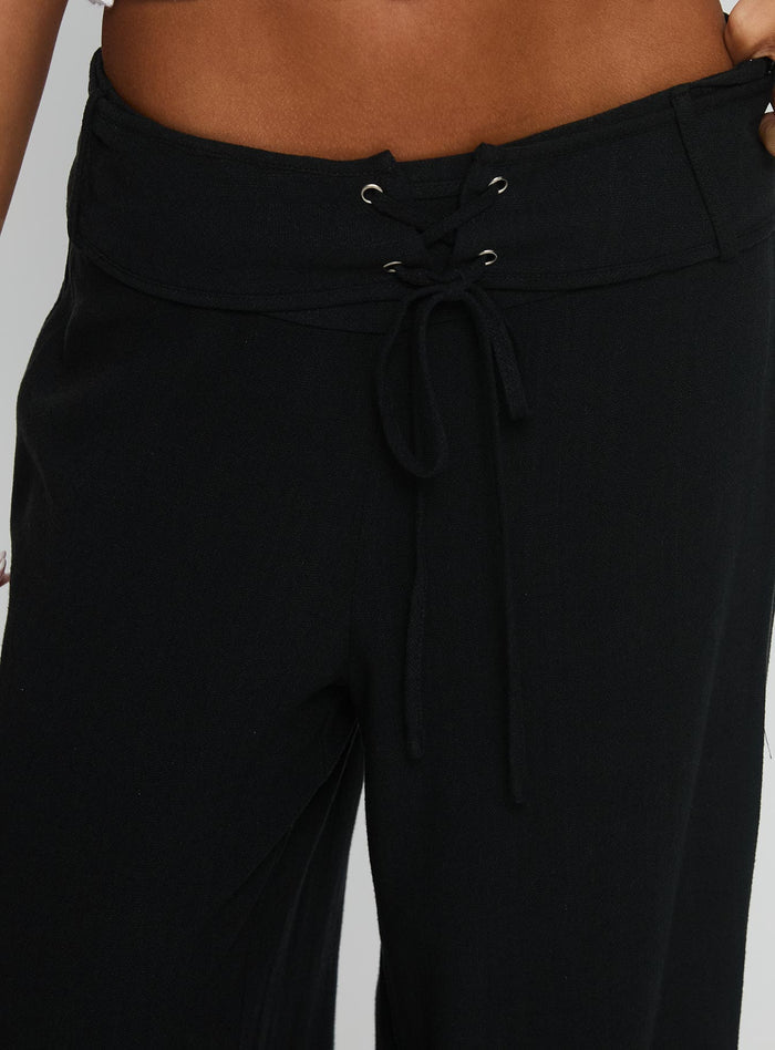 back view of model wearing Princess Polly Raymonde Pants Black High Waisted Pants