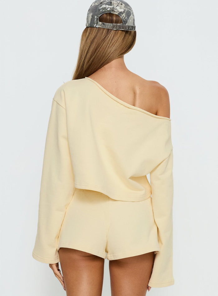 back view of model wearing Princess Polly Retreat Raw Edge Off Shoulder Jumper Buttercream cropped