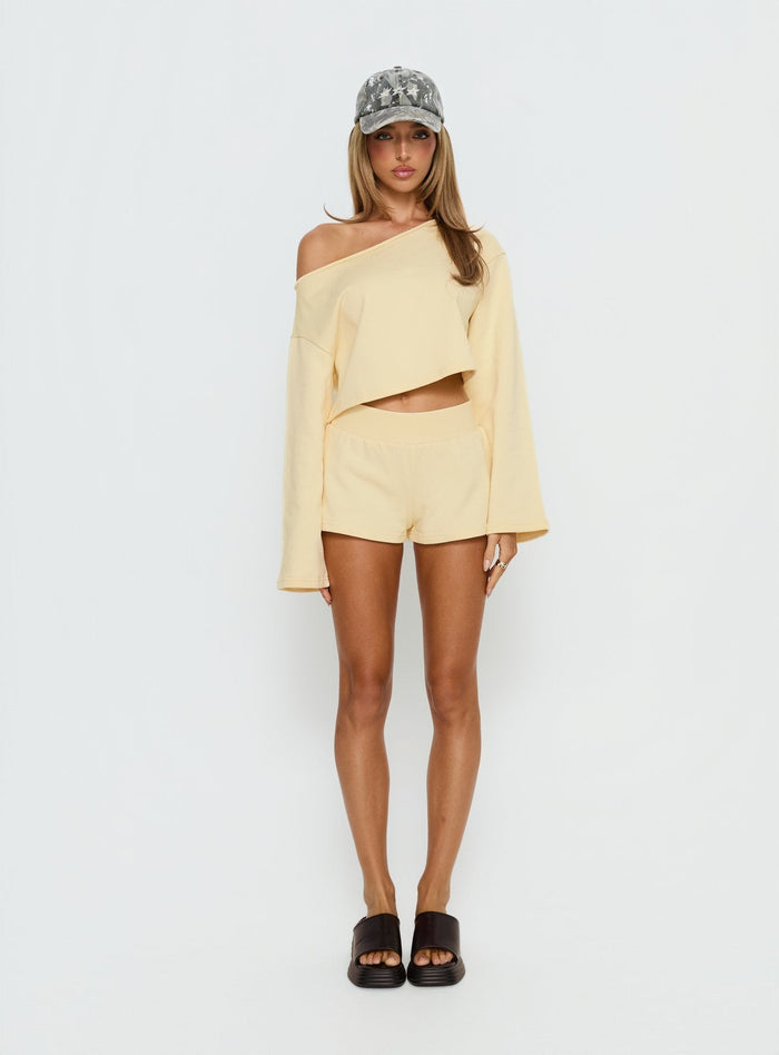 front view of model wearing Princess Polly Retreat Raw Edge Off Shoulder Jumper Buttercream cropped