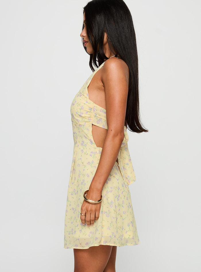 side view of model wearing Princess Polly Rosamie Halter Mini Dress Cream / Floral Square Neck