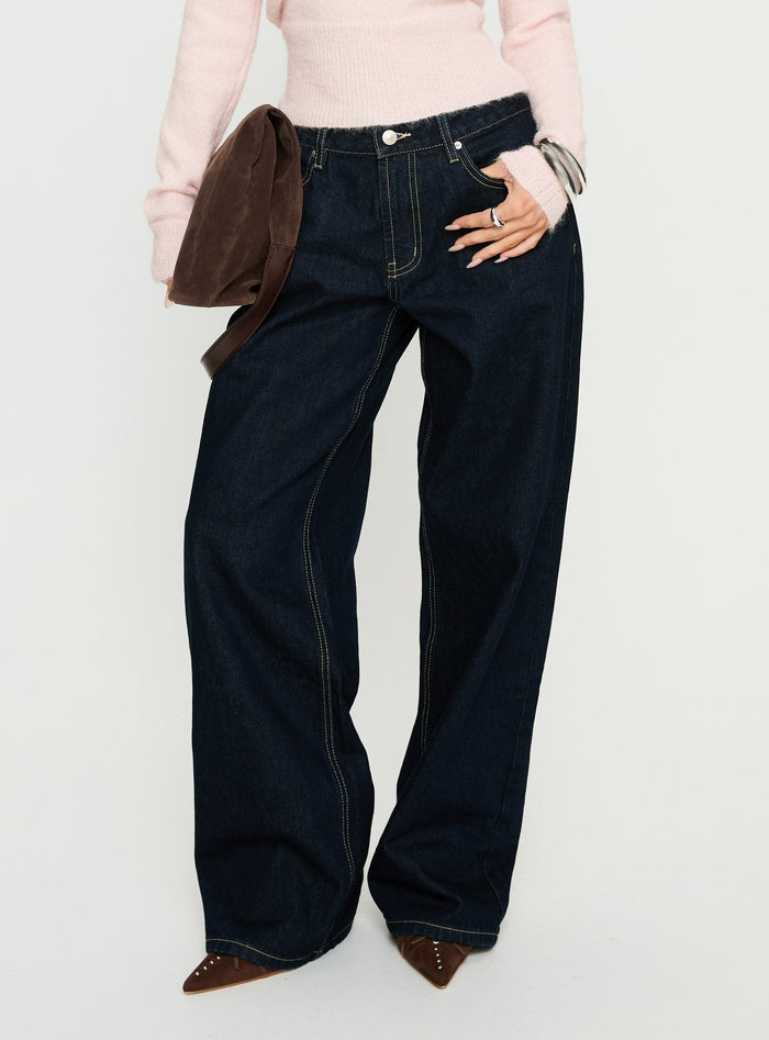 side view of model wearing Princess Polly Serenitia Mid Rise Relaxed Jeans Dark Raw Wash Mid Rise Jeans