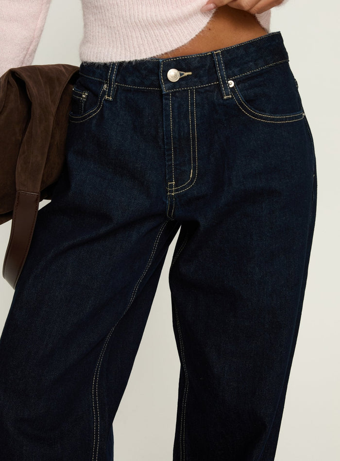 back view of model wearing Princess Polly Serenitia Mid Rise Relaxed Jeans Dark Raw Wash Mid Rise Jeans