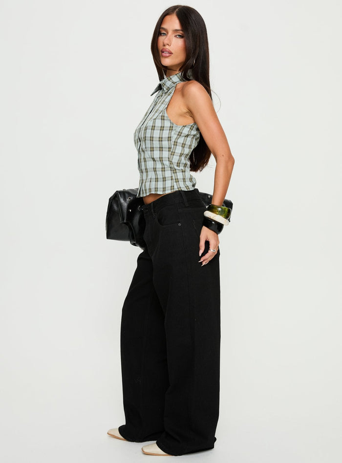side view of model wearing Princess Polly Serenitia Mid Rise Relaxed Jeans Jet Black Mid Rise Jeans Jeans