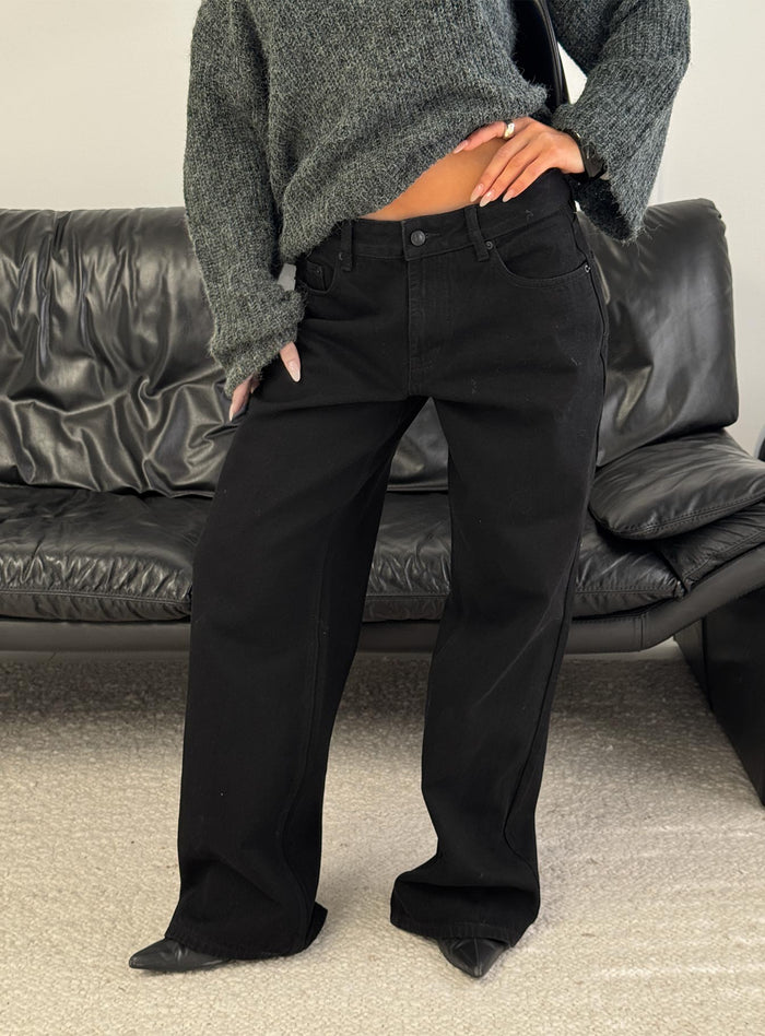 back view of model wearing Princess Polly Serenitia Mid Rise Relaxed Jeans Jet Black Mid Rise Jeans Jeans