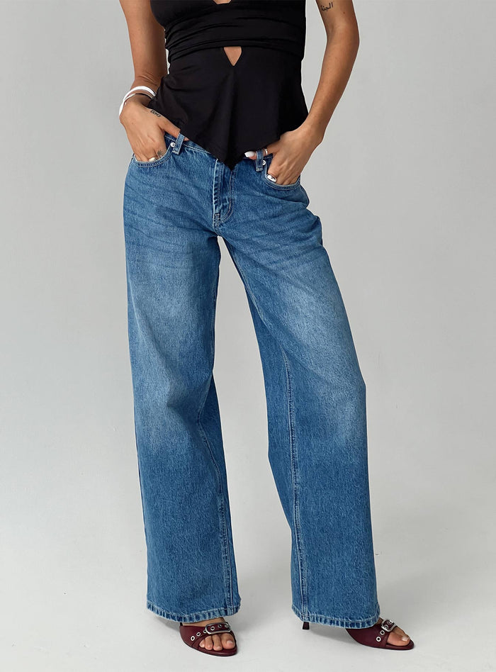 front view of model wearing Princess Polly Serenitia Mid Rise Relaxed Jeans Mid Blue Wash Mid Rise