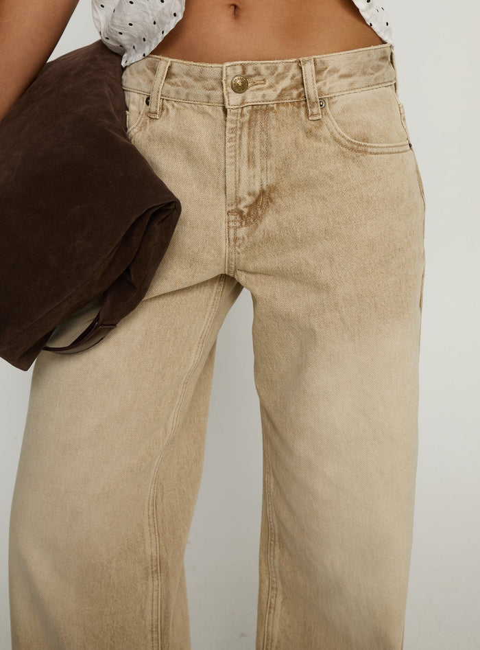back view of model wearing Princess Polly Serenitia Mid Rise Relaxed Jeans Sandy Brown Wash Mid Rise Jeans