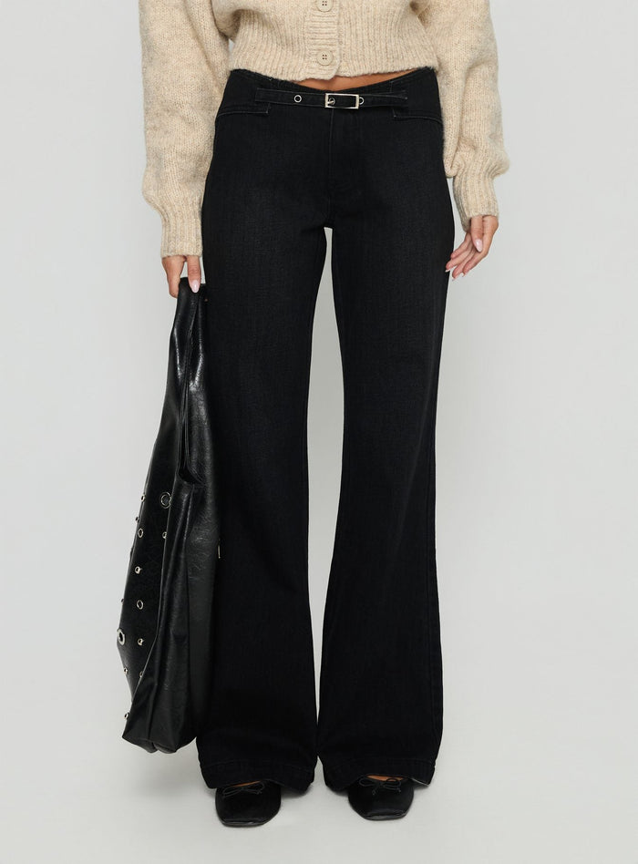 side view of model wearing Princess Polly Slow Ride Mid Rise Bootleg Belted Jeans Washed Black Mid Rise Jeans