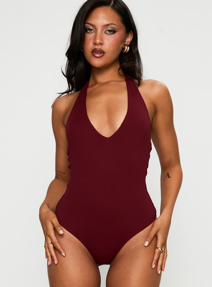 front view of model wearing Princess Polly Someone New Halter Bodysuit Burgundy Sleeveless