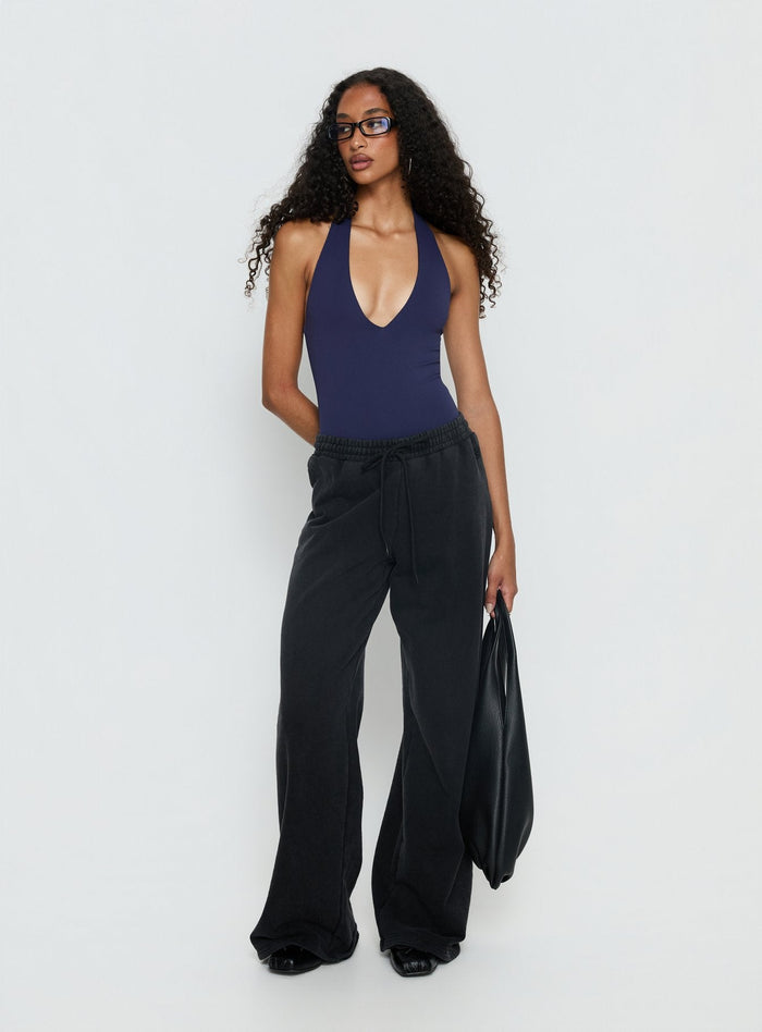 front view of model wearing Princess Polly Someone New Halter Bodysuit Navy Sleeveless Bodysuit