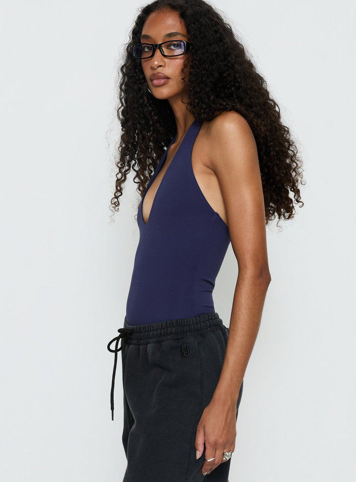 side view of model wearing Princess Polly Someone New Halter Bodysuit Navy Sleeveless Bodysuit