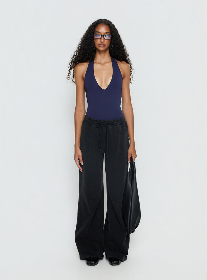 side view of model wearing Princess Polly Someone New Halter Bodysuit Navy Sleeveless Bodysuit