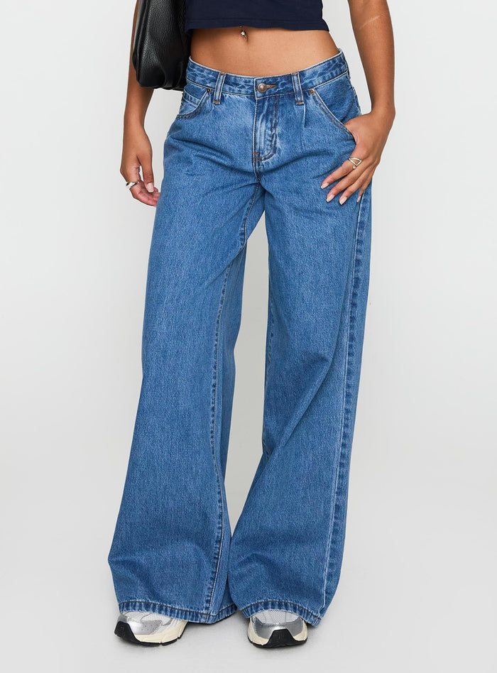 front view of model wearing Princess Polly Supercut Pleat Jean Mid Blue Low Rise Jeans