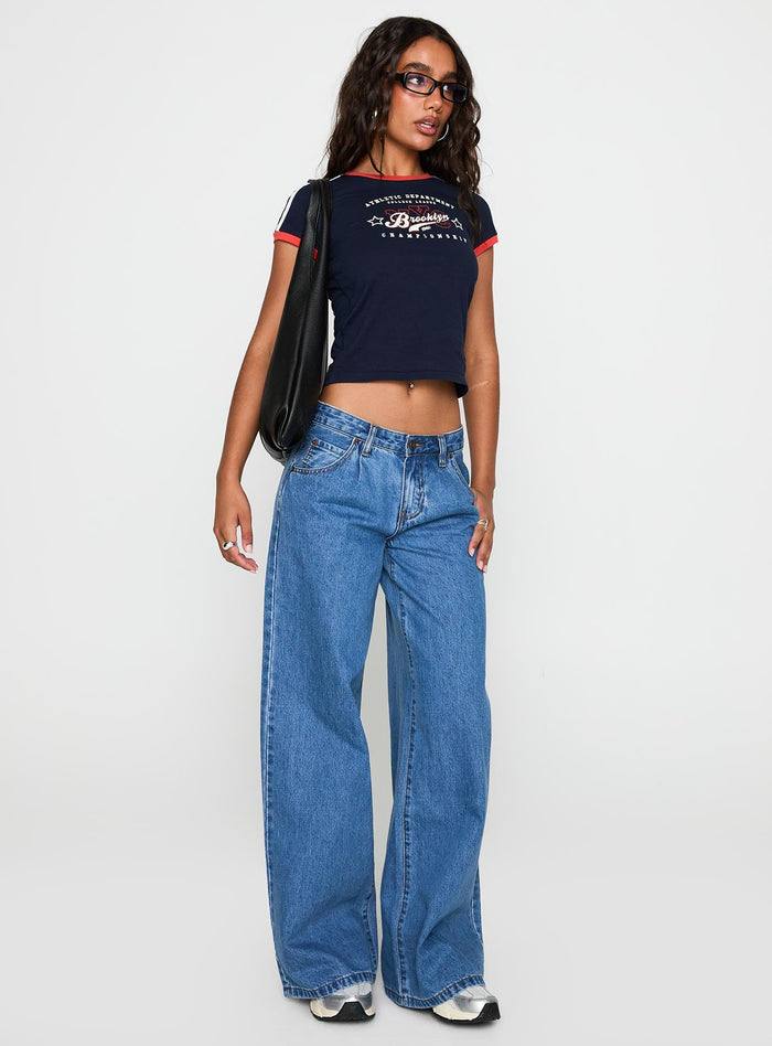 front view of model wearing Princess Polly Supercut Pleat Jean Mid Blue Low Rise Jeans