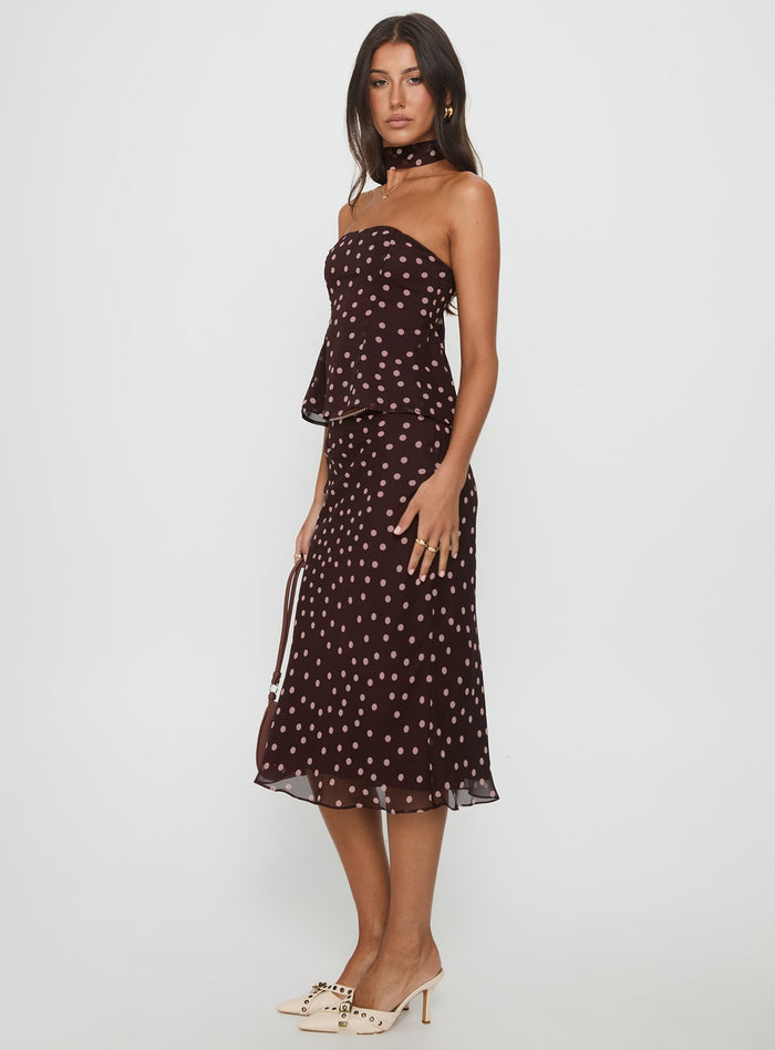 side view of model wearing Princess Polly Sydni Midi Bias Cut Skirt Chocolate / Pink Polka Midi Skirts Skirts