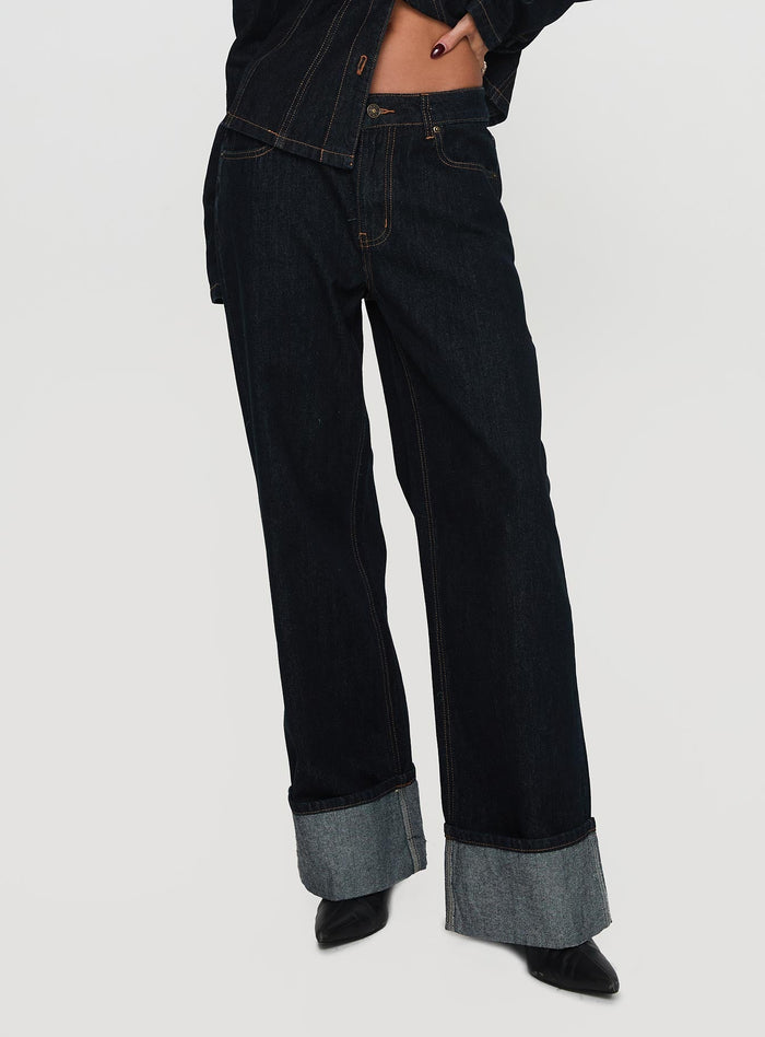 back view of model wearing Princess Polly Top Model Cuffed Jean Dark Denim Mid Rise