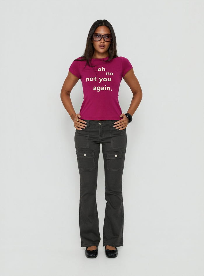 Crafted from charcoal fabric, the Trust Fund Low Rise Bootleg Cargo Pants in womens regular pants, front view of model wearing Princess Polly