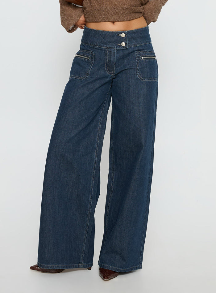 side view of model wearing Princess Polly Unwritten Mid Rise Wide Leg Jeans Dark Blue Wash Mid Rise Jeans